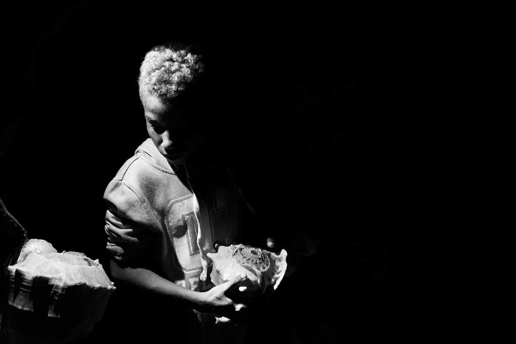 Boy Holding Conch Shell
