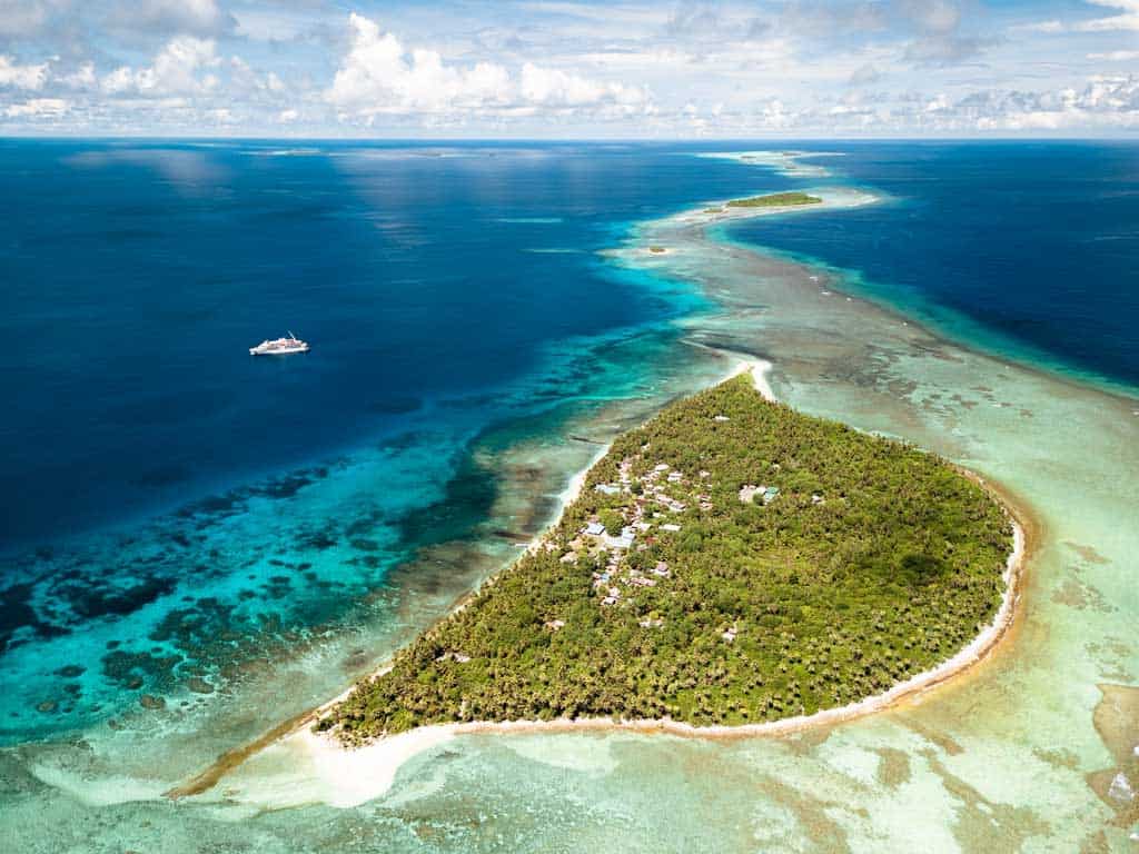 Drone Shot Of Island And Ship